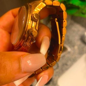 Gold MK women’s watch with pink face